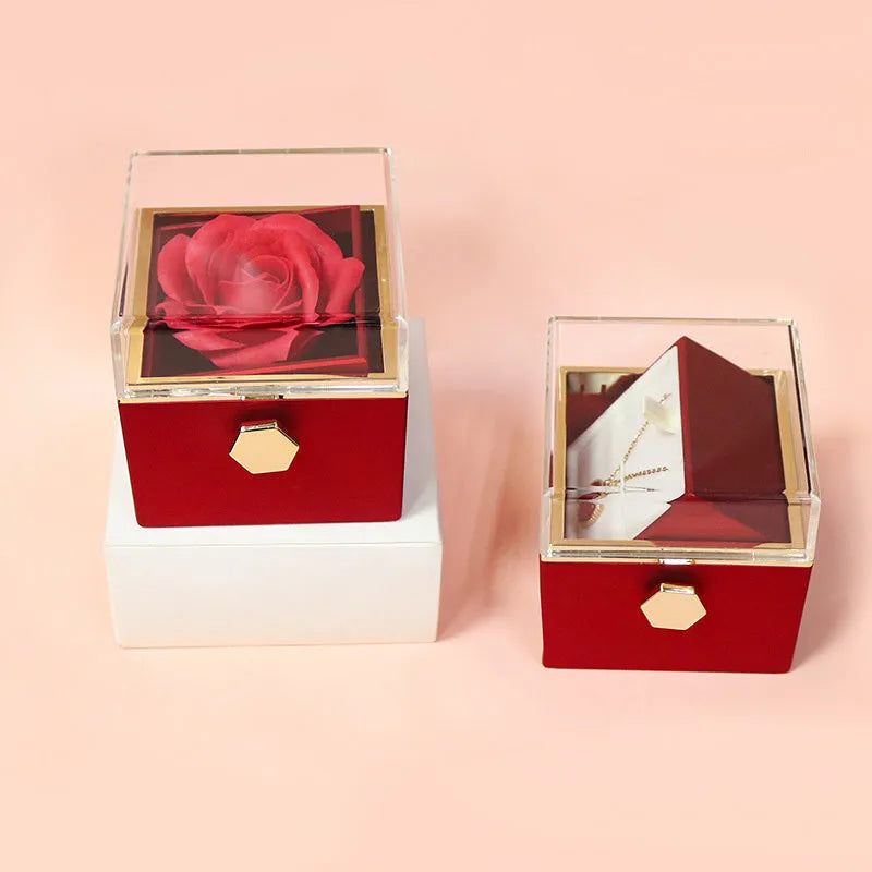 Rotating drawer jewellery gift box with red preserved rose under clear acrylic dome, showing open compartment.