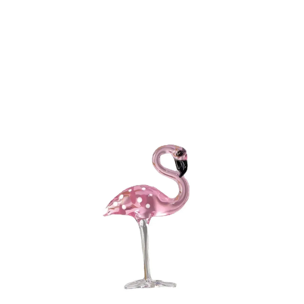 Pink flamingo crystal decorative ornament on a table in modern minimalist style.