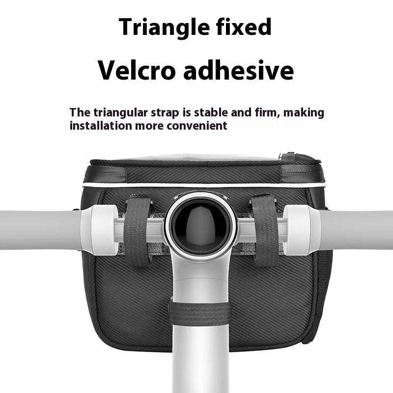 Black folding bicycle handlebar bag with hanging loop, shown attached to bike bars.