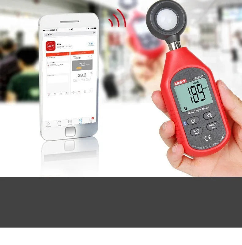 UT383 mini digital lux meter measuring light level with backlit LCD display