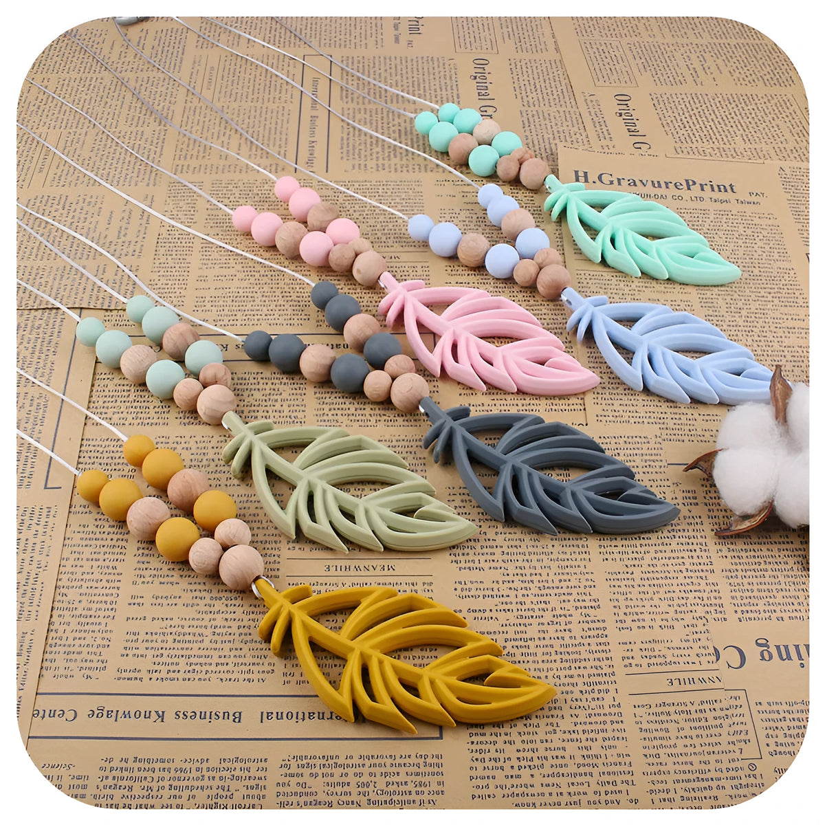 Baby silicone leaf teether necklace in mint green on a light background, BPA-free, 35g, for 3+ months