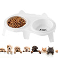 Blue ceramic cat food and water bowl set on a white stand with a hook, showing tilted feeding angle.