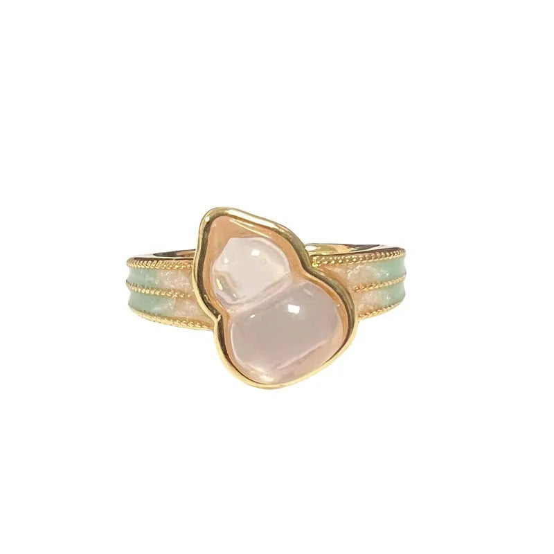 Close-up of a copper adjustable gourd ring with vintage oil-dripping finish and inlaid zircon stone.