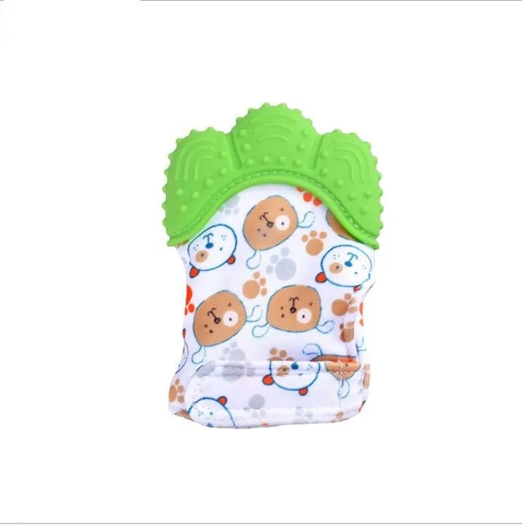 BPA-free silicone baby teether glove fastened with a white Velcro strap on a baby's hand
