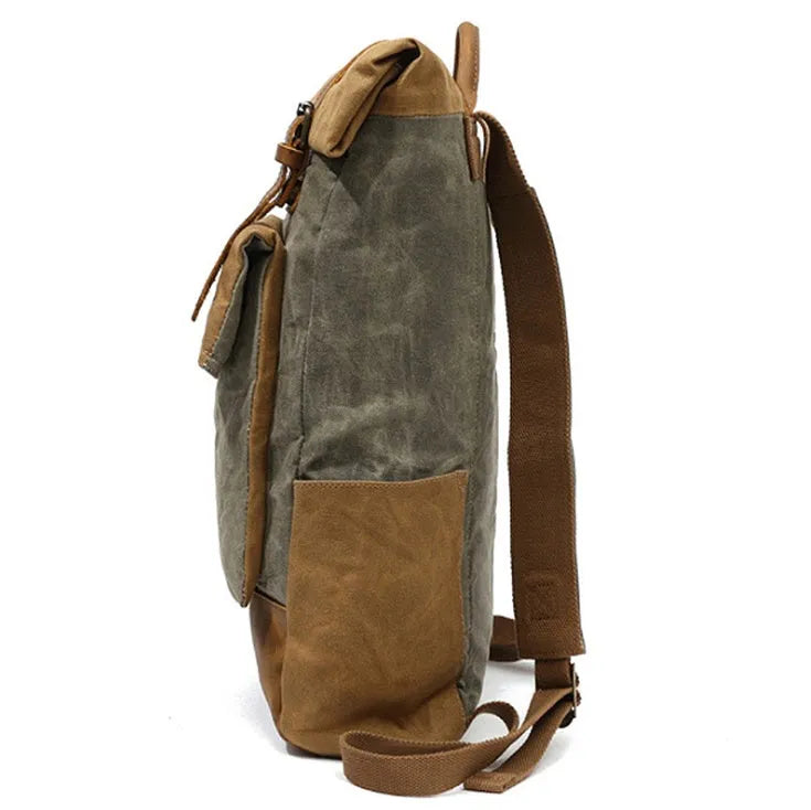 Canvas vintage backpack in khaki showing front zipper pocket and curved shoulder straps with retro square shape