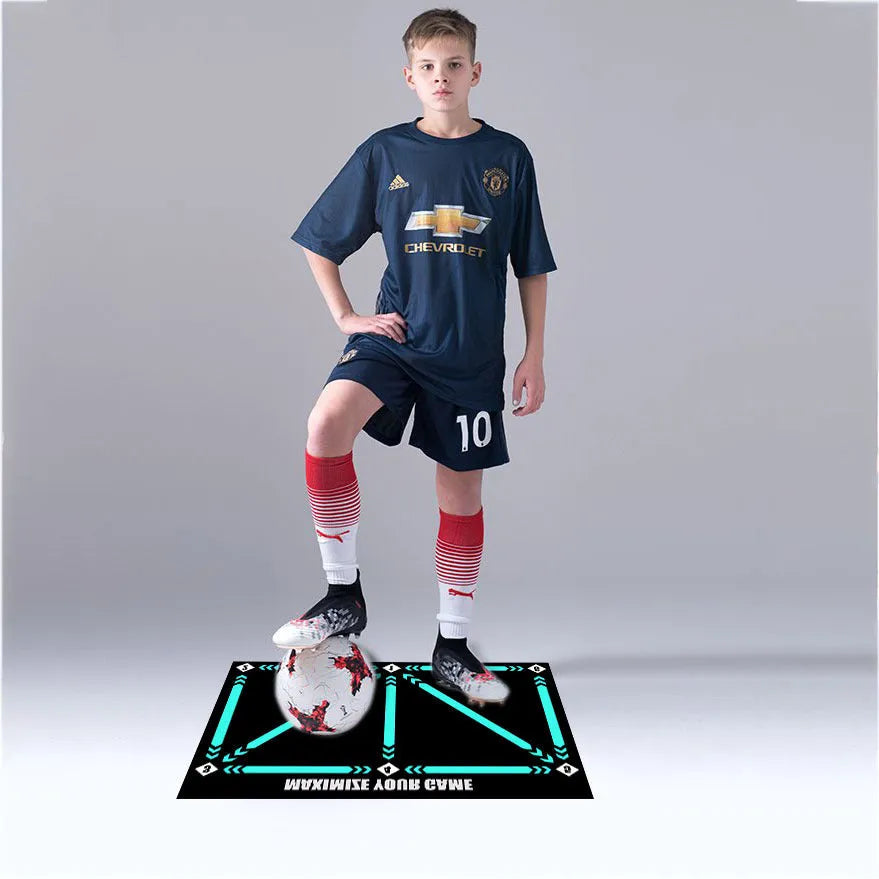 Black non-slip football training mat measuring 60cm by 90cm on a flat surface