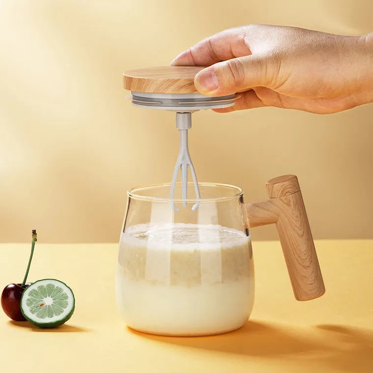 Clear borosilicate glass self-stirring coffee mug with button on base, 400ml capacity