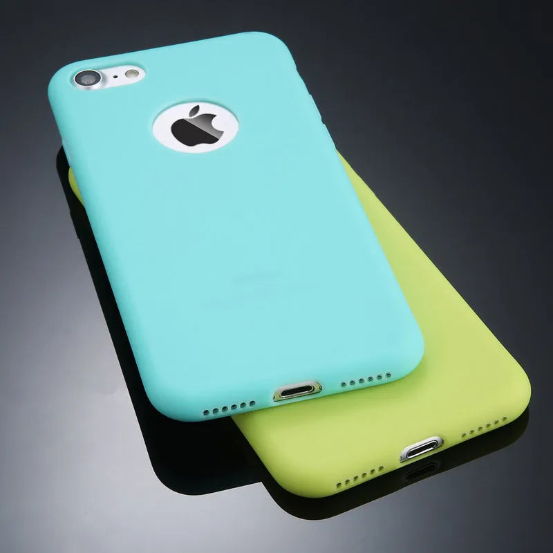 Soft silicone TPU iPhone case in candy colours including pink, blue and red on a plain background