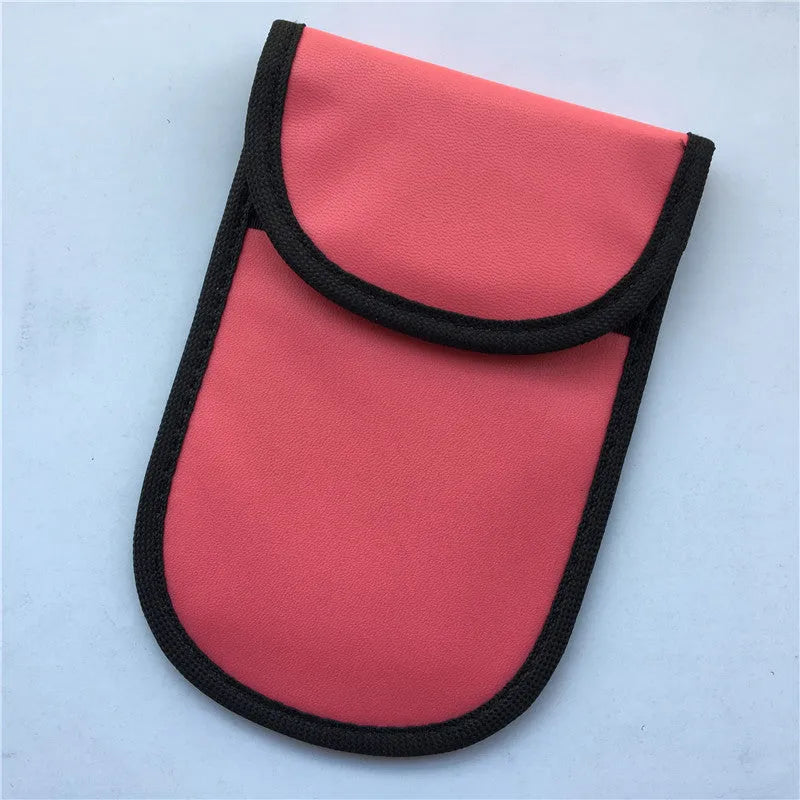 Black signal-blocking Faraday pouch for car key fobs, size 20x10 cm, lying flat on a surface