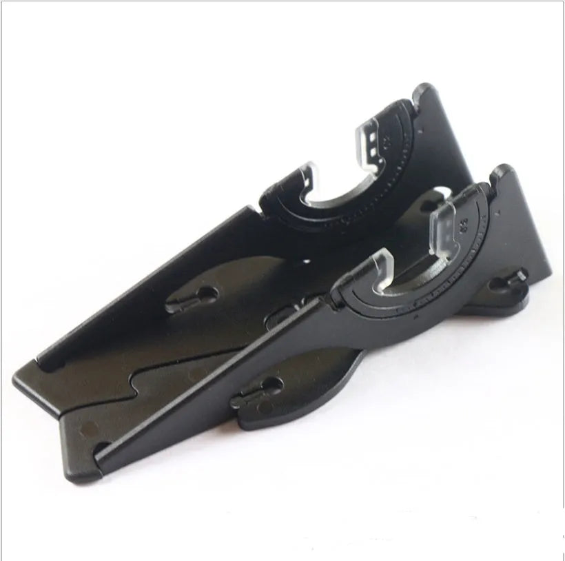 A plastic card type mobile phone holder in six colour options on a desk.