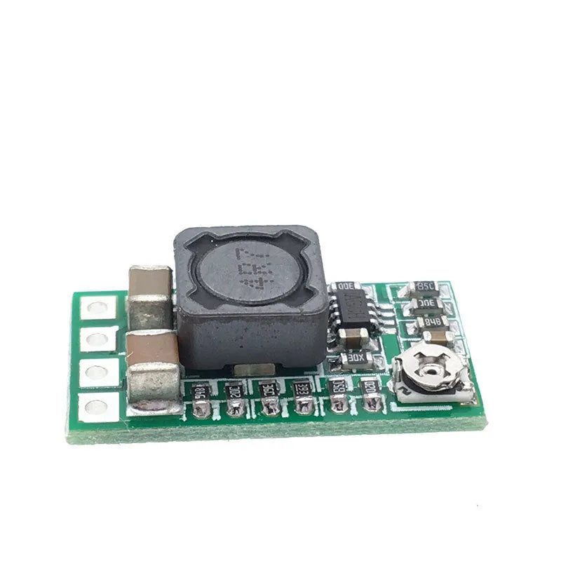Green PCB mini DC-DC step down power supply module converting 12-24V to 5V 3A.