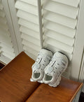 Solid-colour casual shoes with PU leather mesh upper in beige, shown from the side.