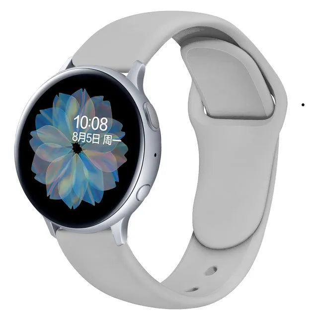 Samsung Galaxy Active 2 watch with a purple reverse buckle silicone strap on a wrist.