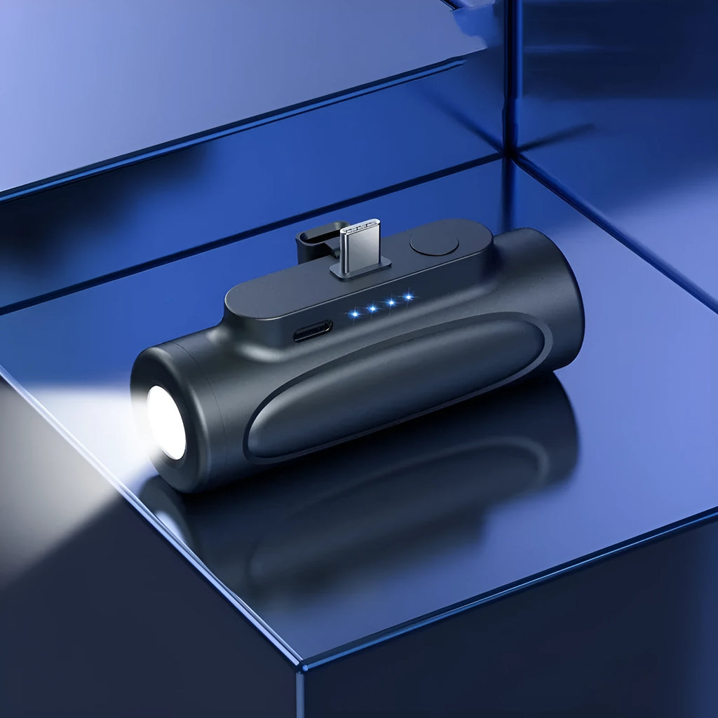 Black Creative Power Bank Glare Flashlight showing LED light on and compact 83mm size next to a mobile phone.