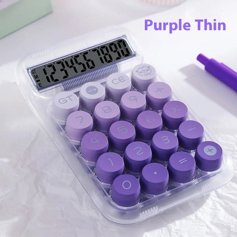 Keyboard-style gradient colour calculator in mute blue, green, pink, or purple on a desk.