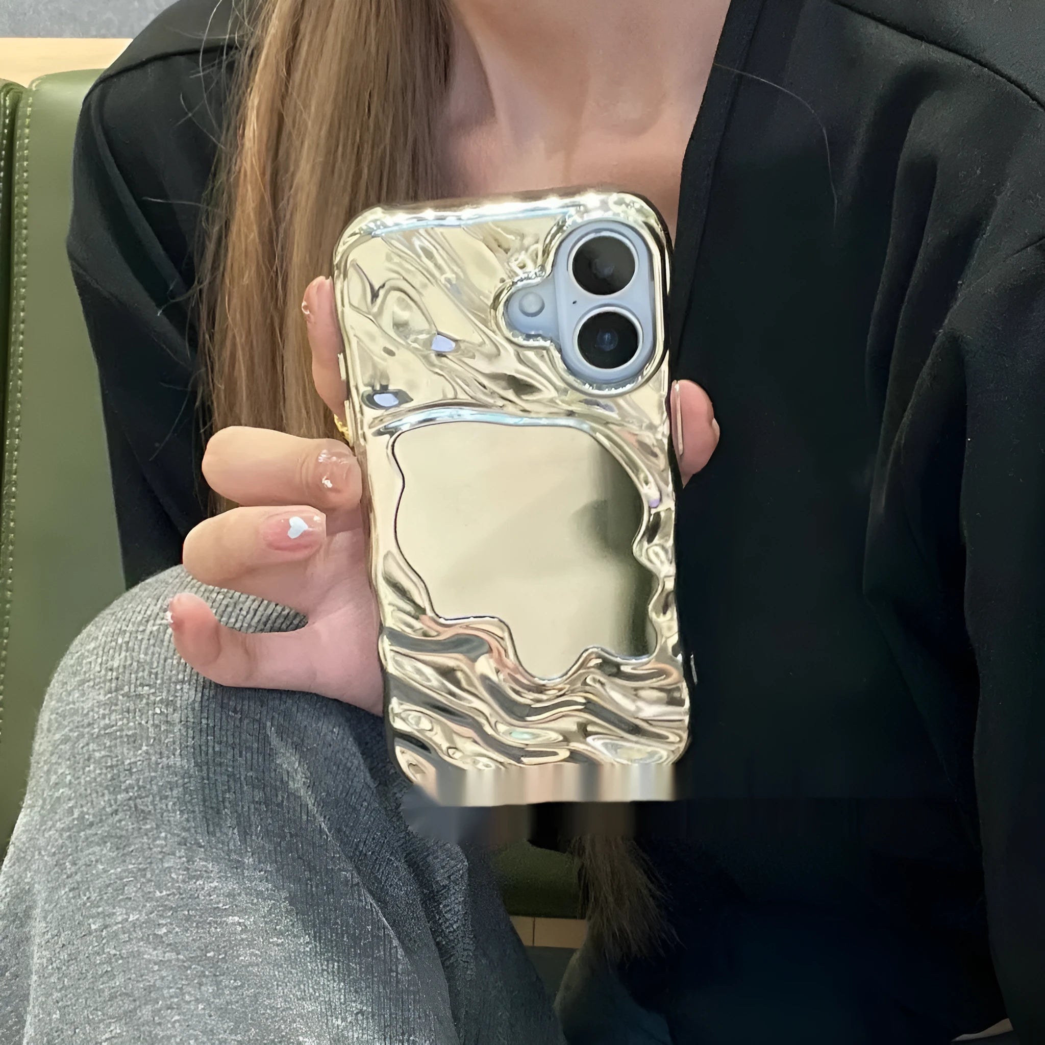 Beige iPhone case with a water ripple texture and a mirrored strip on the back.