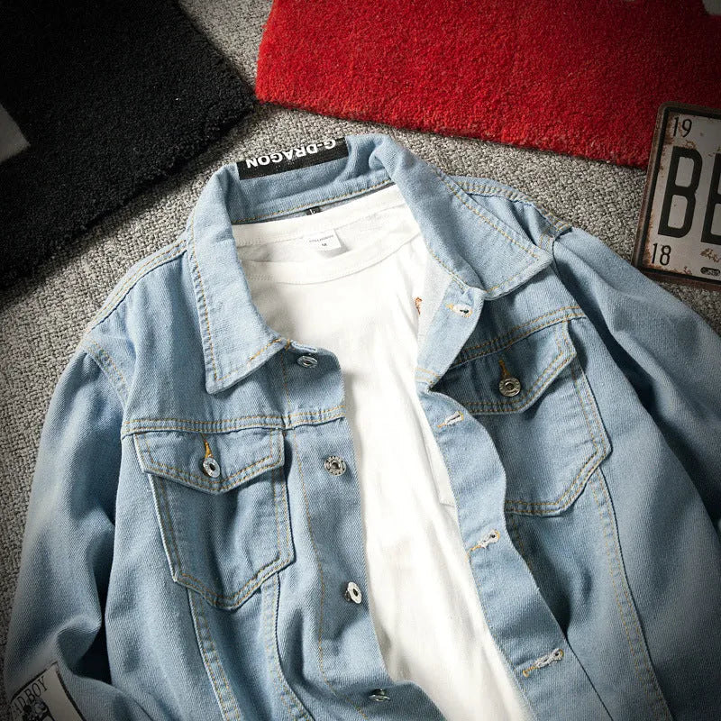 Blue casual denim jacket with lapel collar, loose fit, long sleeves, and multiple pockets