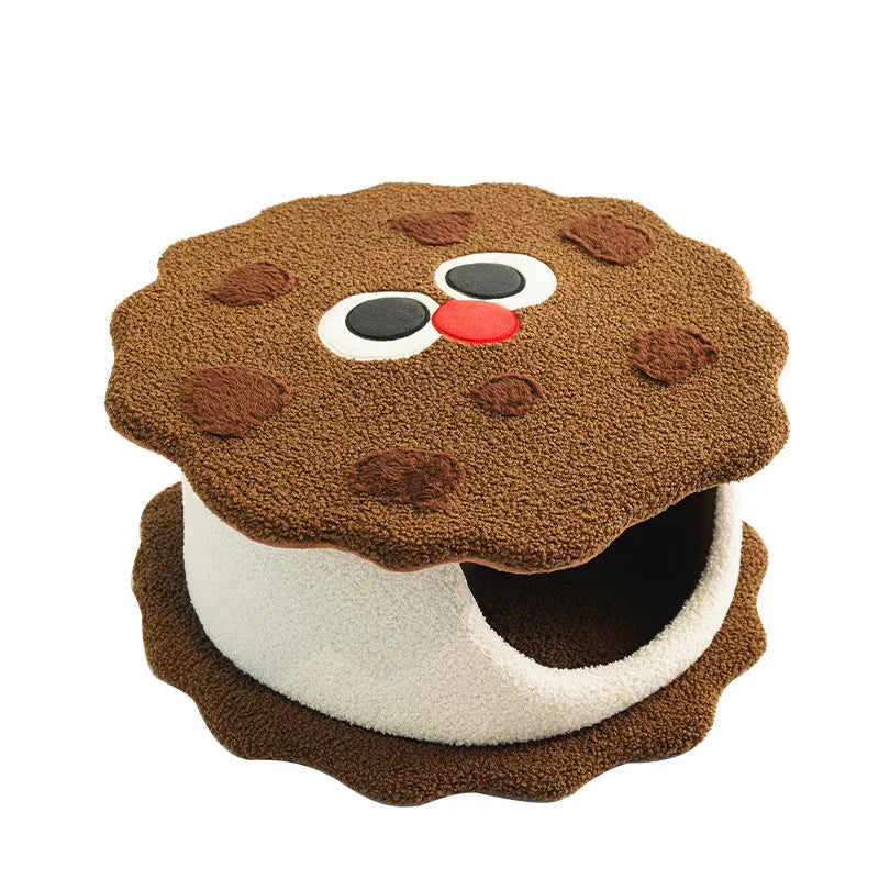 Khaki coloured enclosed cat house shaped like a sandwich cookie nest with a single entry.