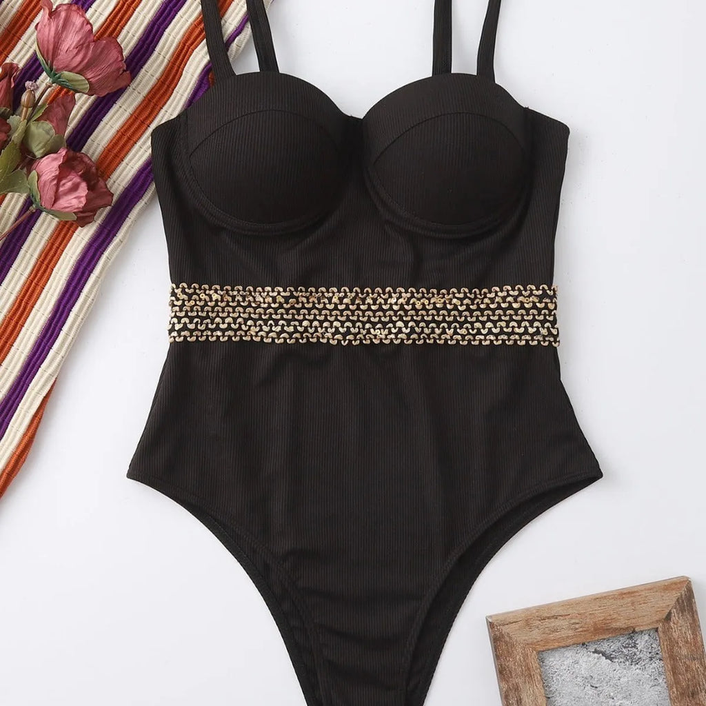 Black women's one-piece swimsuit with adjustable shoulder straps on size chart