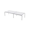 White telescopic plastic kitchen rack with single shelf, shown at adjusted height on a kitchen floor.