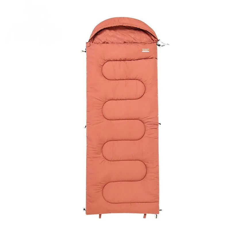 Ultra-light cotton camping sleeping bag quilt shown in ochre and olive green colours, folded for portability.