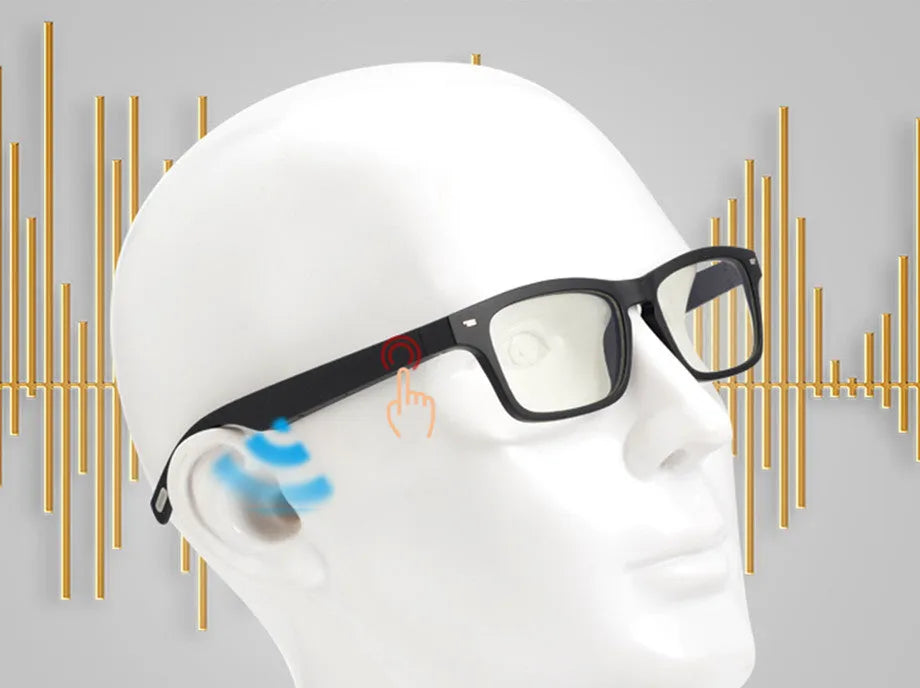 Black smart glasses with Bluetooth speakers and tinted UV-protection lenses on a table.
