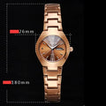 Coffee gold luminous couple watch with alloy strap and quartz movement on a light background