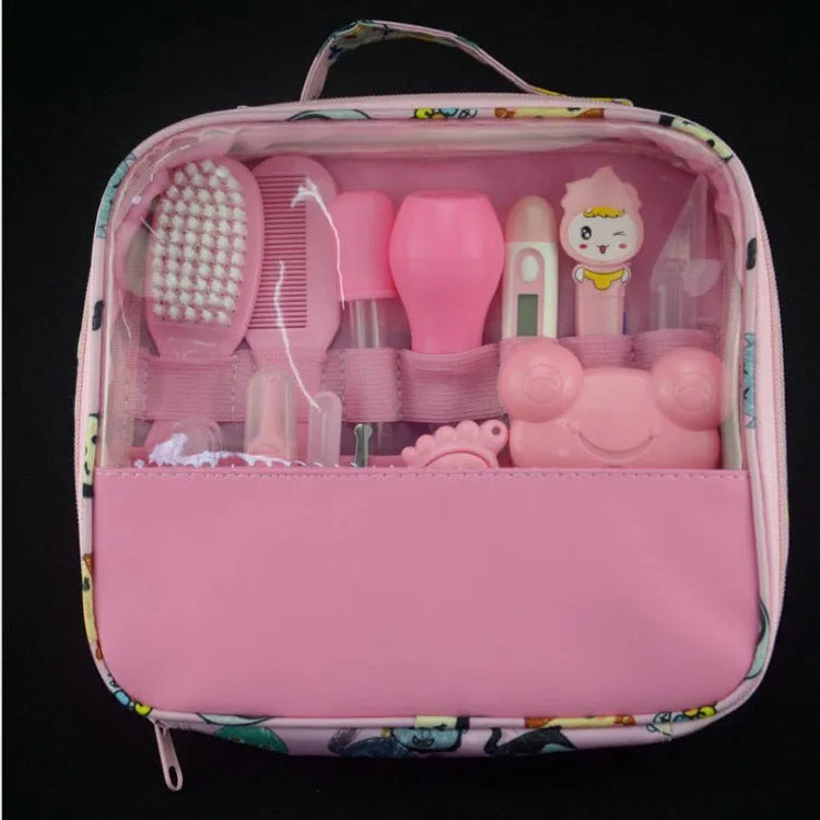 Roadfisher Newborn Baby Care Kit in pink or blue, showing safety scissors, brush, comb, thermometer, and syringe.
