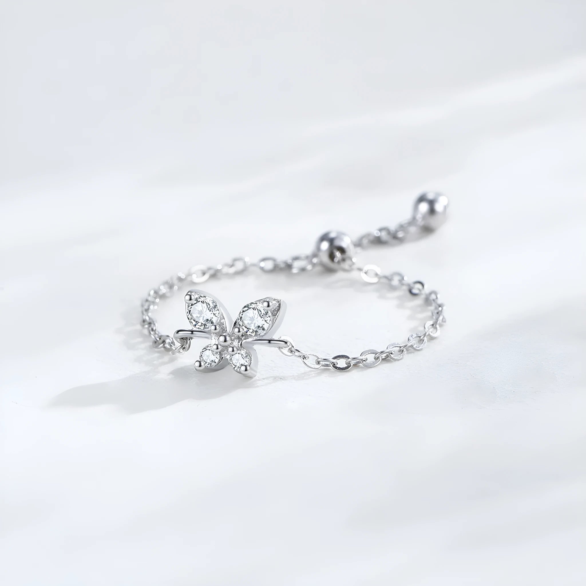 Adjustable silver ring with lively butterfly and inlaid zircon in colour JZ2049 on white background