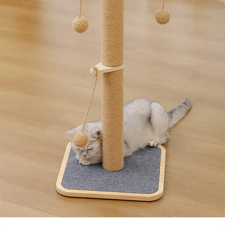 Natural wood tone cat climbing frame with a red hanging ball toy and beige carpet leather scratching surfaces.