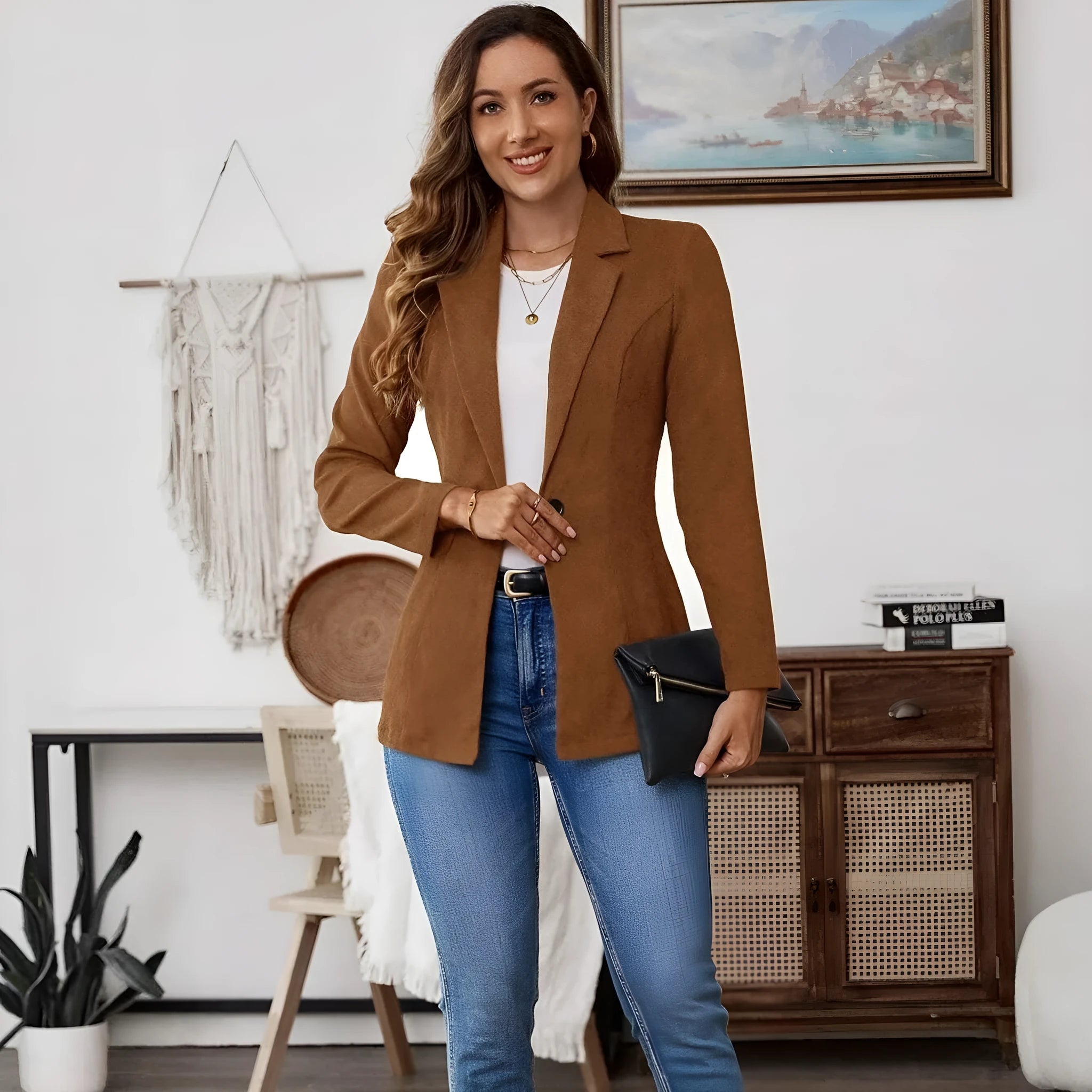 Brown men's single-breasted blazer with lapel collar and long sleeves on a hanger.
