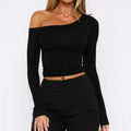 Women's long sleeve slim fit knitted cardigan with cross shoulder straps in red.