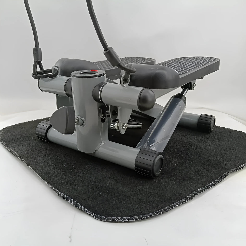 Silver grey household hydraulic pedal exercise machine for waist slimming and cardio.
