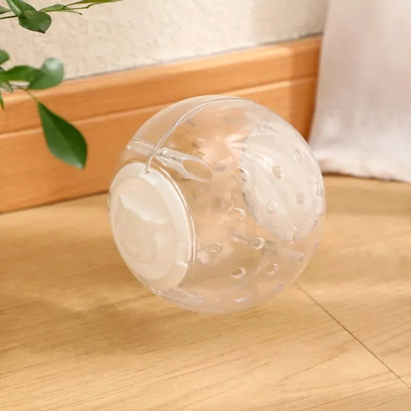 Blue slow feeding ball for cats with leak holes for gradual food dispensing