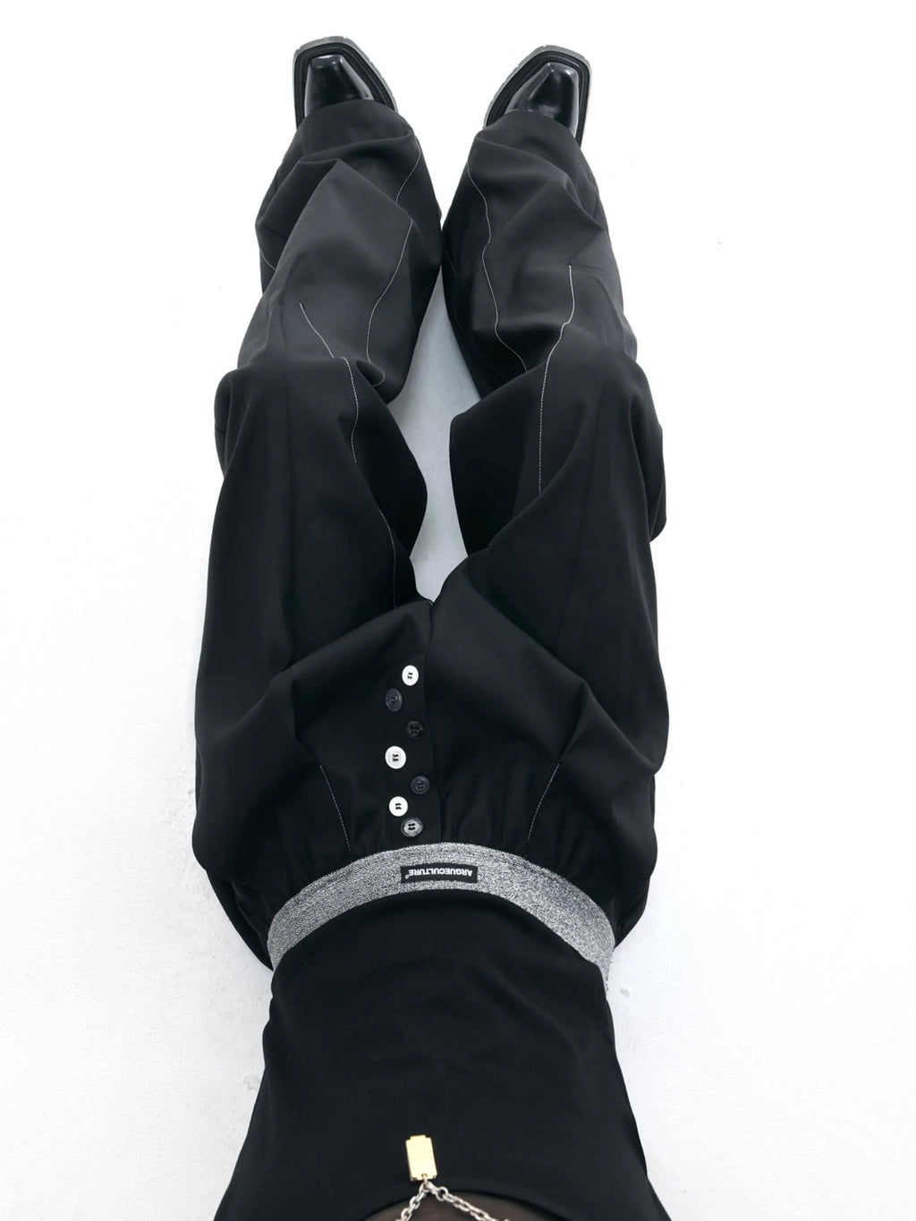 Straight-leg trousers with button-open seam design in black or grey polyester-cotton blend