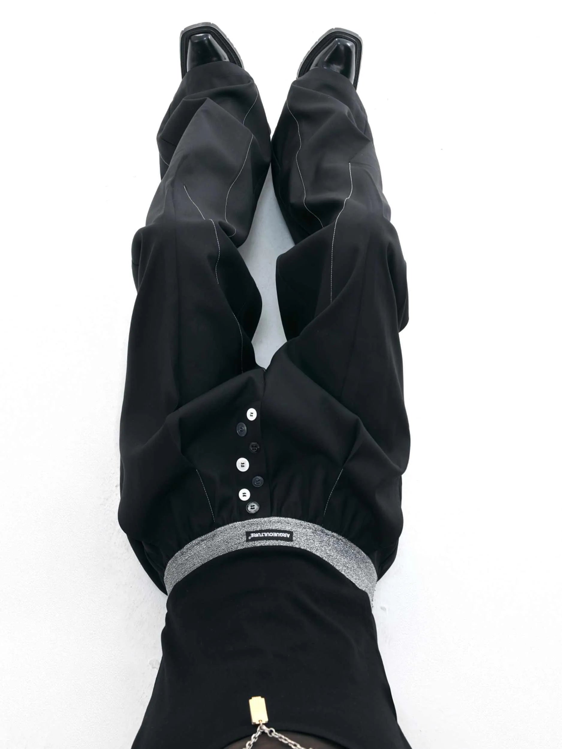 Straight-leg trousers with button-open seam design in black or grey polyester-cotton blend