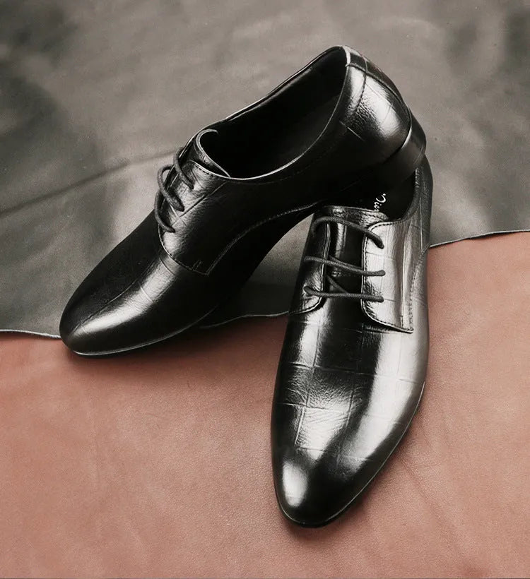 Men's black checkered leather derby shoes with a pointed toe and rubber sole on a white background.