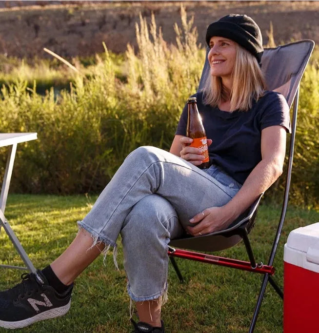 Portable ultralight aluminium camping chair in black with carry bag, folded for transport