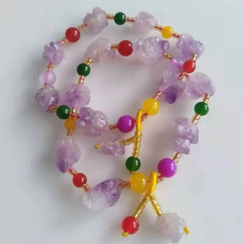 Purple natural shaped amethyst bead bracelet for women with a silver fu character charm.