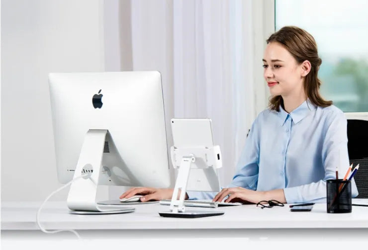 Foldable aluminium phone and tablet stand with black silicone protection showing 360-degree rotation capability