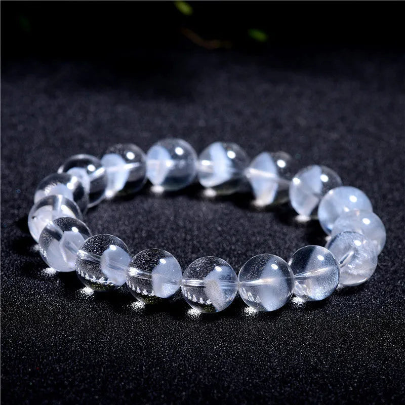 Women's white crystal pyramid bracelet with Ruyi charm showing natural ghost pyramid design