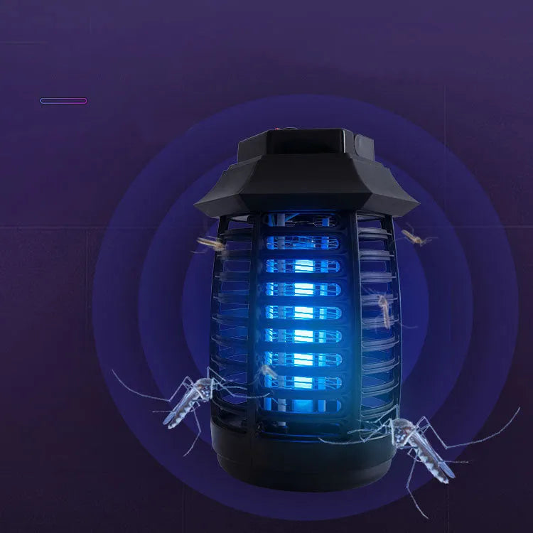 Black aromatherapy mosquito killer lamp with a glass UV tube on a table.