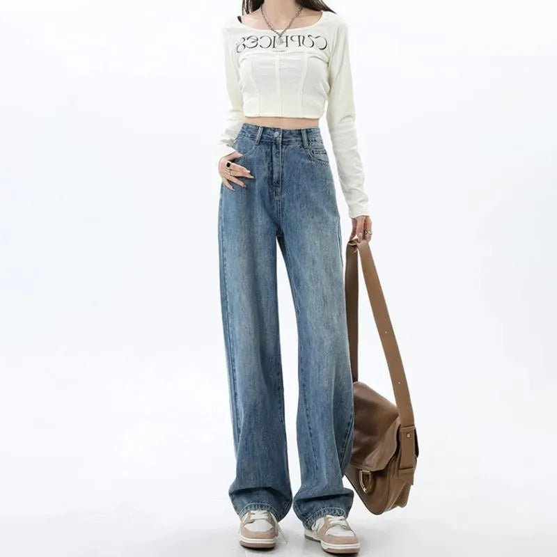 Woman wearing retro blue high-waist wide leg denim jeans with a relaxed fit.