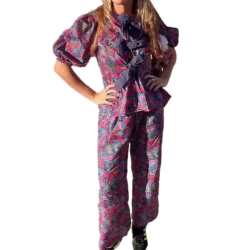 Women's floral print trousers suit with puff sleeves and tie-neck design in picture colour