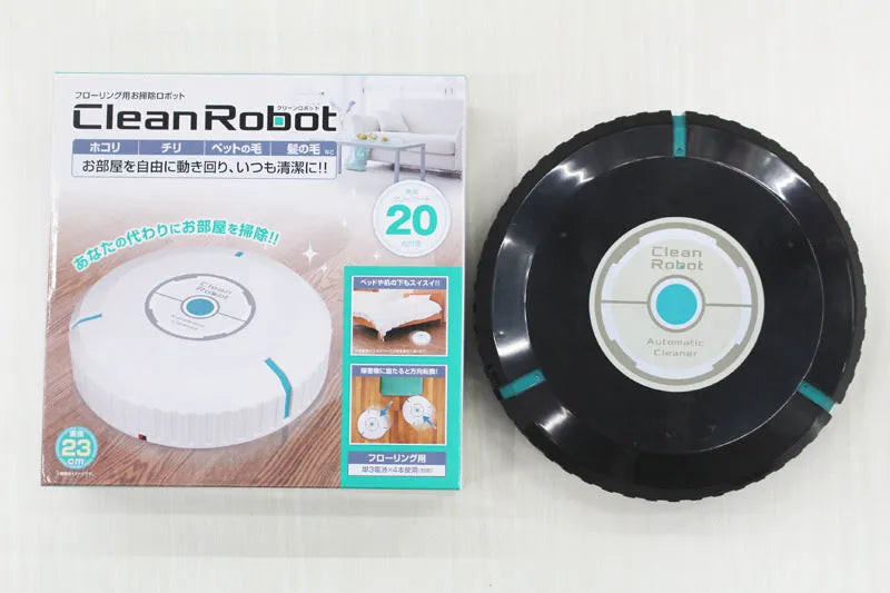 Black or white automatic floor sweeper robot on a hardwood floor.