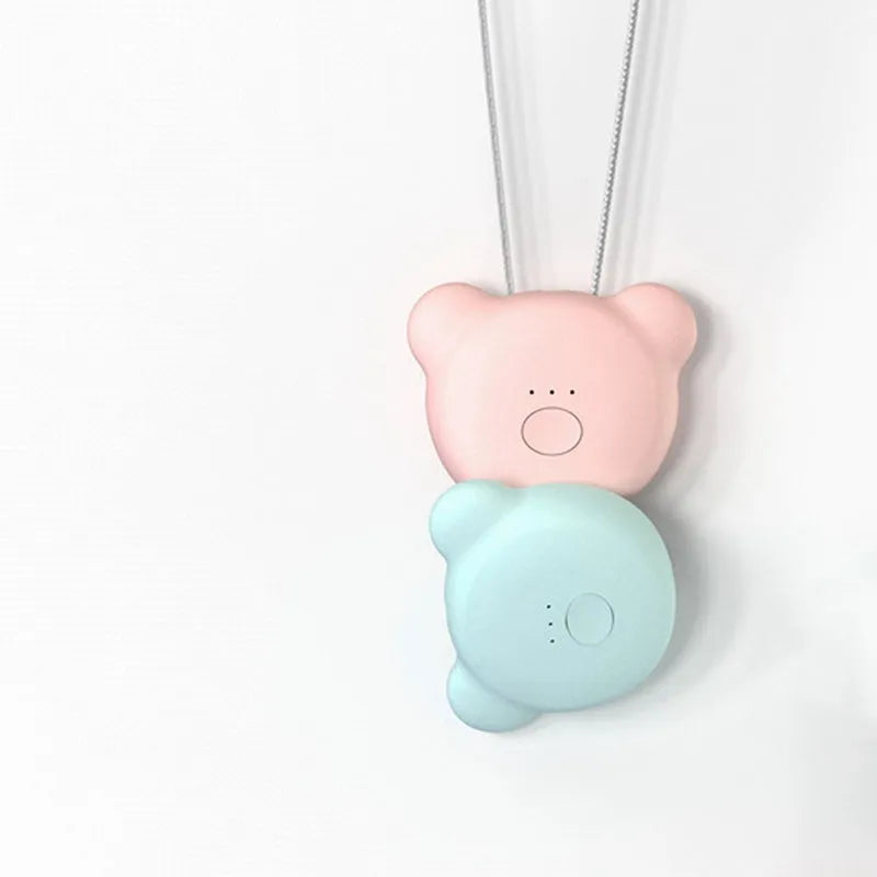 Compact USB-powered air purifier necklace in pink, showing wearable design and one-button control.
