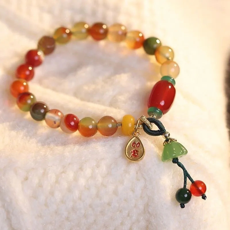 Handcrafted lotus ruyi bracelet with mixed materials and traditional Chinese design