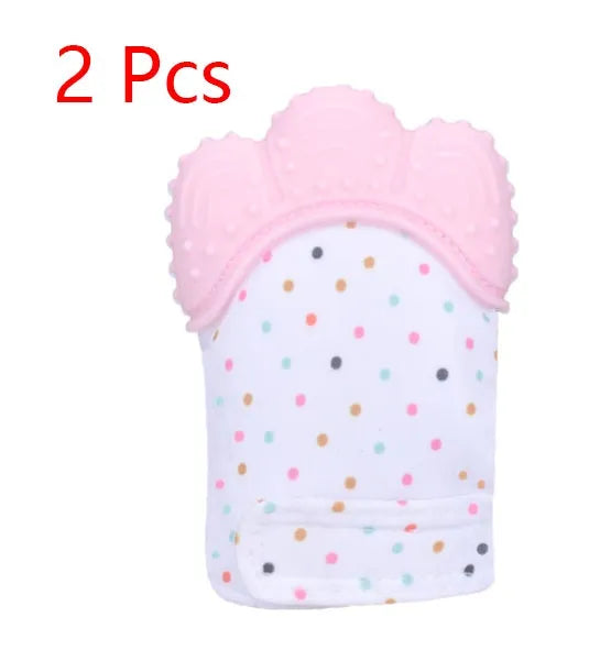 BPA-free silicone baby teether glove fastened with a white Velcro strap on a baby's hand