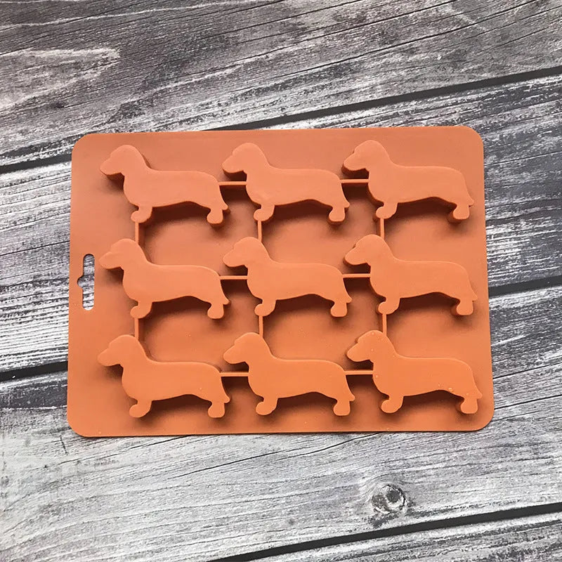Orange silicone ice mold producing animal-shaped ice cubes for creative drinks