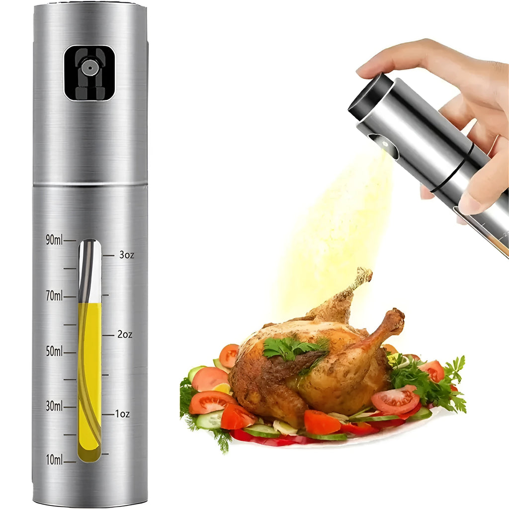 Stainless steel press spray oil injection bottle with glass body and 100ml capacity on kitchen countertop